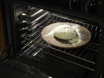 Slide dough into oven on stone